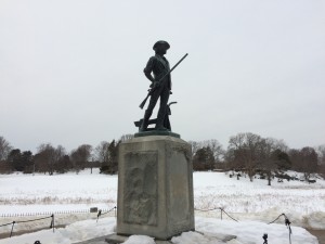 Picture of the statue - which is on the west bank of the river - looking up towards the pasture where the Concord and surrounding town's Militia were arrayed for the battle
