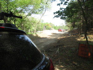 My parent's Subaru in the foreground. Up on the hill, the excavator is clearing out rubble