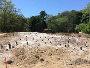 140 holes for the explosives, drilled into the Gneiss rock. The black 'spikes' are tarpaper funnels inserted into the holes. The color contrast doesn't do justice to the pure white rock dust/gravel from the holes. It reminds me of sea salt