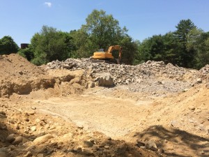 standing at the well head, in the near distance is where the living room will be (on concrete piers). Where the rubble is will be the concrete slab for the garage