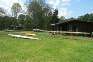 cleaning up boats for the 2015 season.  Two single shells and a ride on top surf kayak.  My dad's high performance shell, which has not been used in several seasons, unfortunately showed a half a dozen delaminations between the deck and hull.  Since it is very lightly built, the loss of integrity has turned it into a bit of noodle.  We may come to a decision to apply fiberglass in long strips along the joints but due to its age, I think the decision is likely to come back as it is terminal rot. My mom's shell is in the foreground and it is a sweet ride