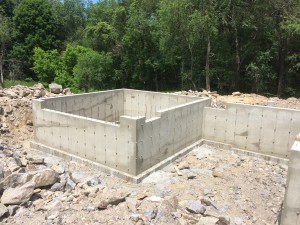 Foundation for the garage (left) aka - The Shop - and the carport on the right