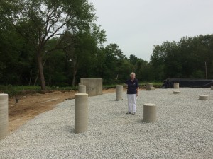 My Mom standing in the newly graded great room area with the fireplace foundation behind her to the left. Paul put down a fabric and then 1/2 inch crushed stone to try and discourage critters from digging holes under the house