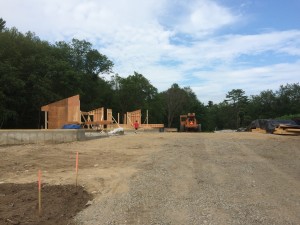 Progress as of July 9th. The walls are starting to go up! Mason checking out the scene