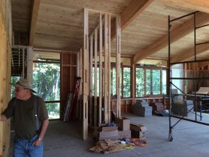 The view from the entry, across the future kitchen and into the computer/office area on the left and the living room on the right